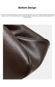 Gros plan sur le design arrondi du fond de ce sac baguette en cuir marron foncé