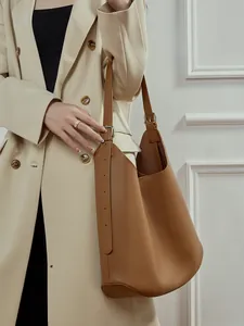 Minimalist brown leather hobo shoulder bag with adjustable strap for a stylish casual look