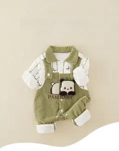 Detail of newborn green panda romper featuring classic knit texture and soft cotton collar