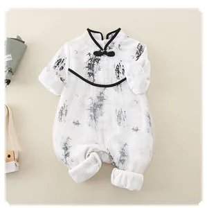 Close-up of ink wash bamboo print on baby romper with traditional Chinese knot button