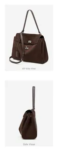 Detail view of large dark brown suede tote bag featuring silver twist lock and side gussets
