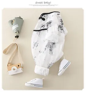 Detail of baby romper with traditional Chinese ink bamboo print and soft cotton fabric