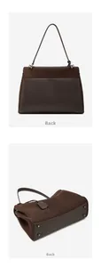 Detail view of the dark brown matte leather handbag showing the back and bottom with metal feet