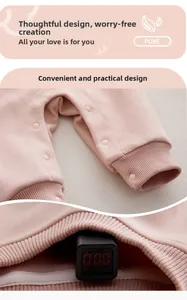 Dettaglio tutina neonato rosa con bottoni a pressione e test di fluorescenza zero