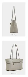 Detail view of the side and back of a light gray leather tote bag with a zipper pocket