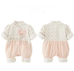 Detail view of floral Chinese style baby romper with bow and ribbed texture fabrics