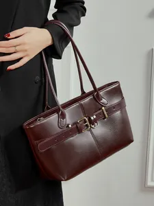 High-quality burgundy leather tote bag with elegant belt detail and large capacity