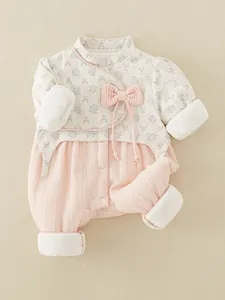 Floral Chinese style long sleeve baby romper in pink and beige with bow detail