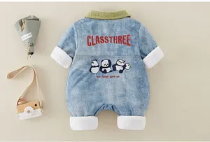 Detail of infant denim romper with panda embroidery and soft ribbed knit green collar