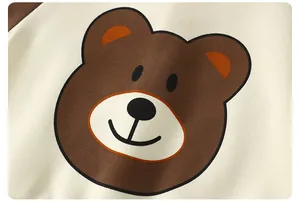 Close-up of a cute cartoon bear print on high-quality knitted cotton children's clothing