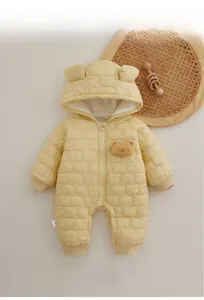 Detail of baby quilted romper featuring 3D bear embossing and cute hooded ears