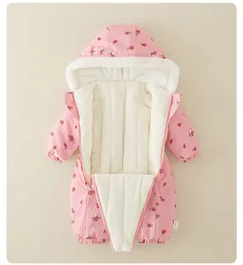 Detailed view of pink floral baby jumpsuit with cozy fleece lining and dual zippers