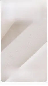 Macro shot of soft combed ivory fabric texture for infant winter jumpsuits