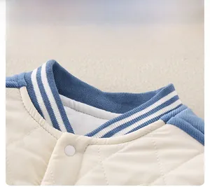 Detail of baby quilted baseball romper with ribbed knit collar and snap button closure