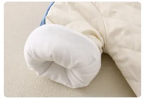 Close-up of quilted diamond pattern and soft ribbed cuffs on baby winter jumpsuit