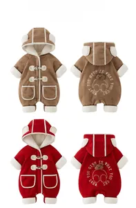Detail of baby thermal romper featuring plush bear ear hood and toggle button closure