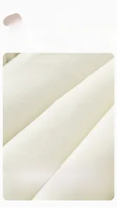 Close-up of soft skin-friendly cream fleece fabric with non-pilling combed texture