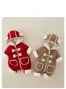 Detail view of baby New Year romper with warm sherpa fleece lining and horn buttons
