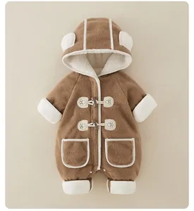 Detail view of baby fleece jumpsuit with bear ear hood and classic horn buttons