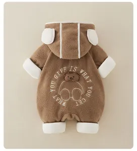 Detail of baby winter romper with bear ear hood and textured fleece material