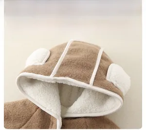 Close-up of thick fleece lining and cute ear detail on warm winter baby romper