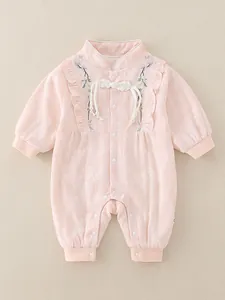 Pink floral jacquard baby romper with Chinese collar, embroidery and ruffle details