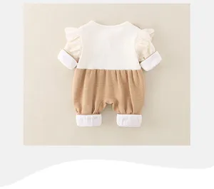 Detailed view of baby romper featuring delicate white lace trim and ribbed cotton texture