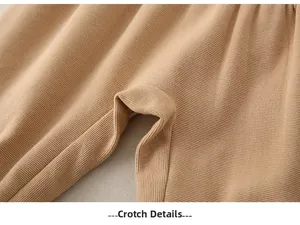 Close-up of durable crotch stitching and ribbed cotton fabric on baby jumpsuit