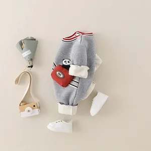 Gray baby fleece romper with panda pocket and striped collar on a beige background