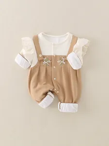 Baby cotton romper with long sleeves, floral embroidery, and delicate lace details in cream