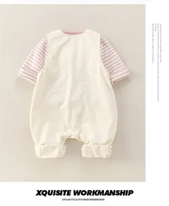 Detail of baby romper with pink striped sleeves and exquisite cuff workmanship
