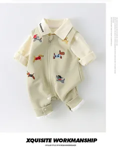 Detail of baby cotton overall set featuring green jumpsuit with cute puppy embroidery