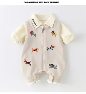 Detail of baby cotton romper featuring cute dog embroidery and front zipper closure