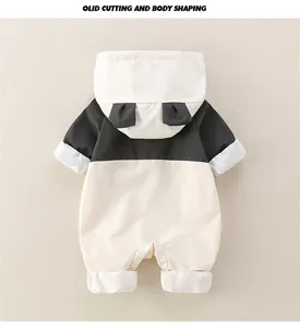 Detail of baby panda hooded romper with cute 3D ears and contrast black-white design