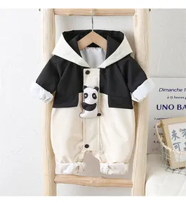 Detail of baby hooded romper with cute panda patch and black and white color blocking