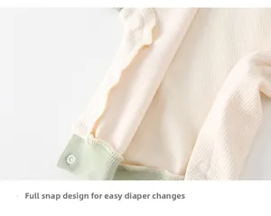 Close-up of baby romper with waffle texture and snap buttons for easy diaper changes