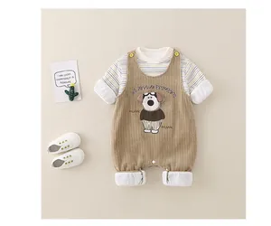 Detail of infant corduroy overalls with cartoon dog embroidery and striped long sleeve shirt