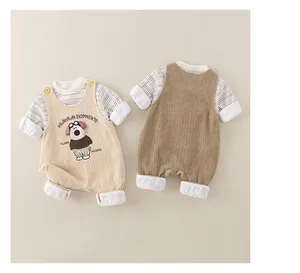 Detail view of baby flannel jumpsuit set showing cartoon dog patch and corduroy texture