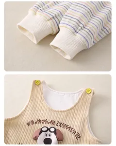 Detail of baby romper featuring colorful striped cuffs and a cute 3D dog applique patch