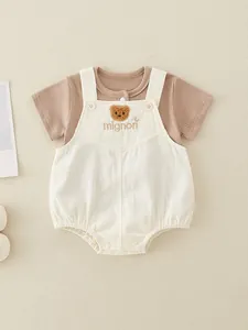 Infant two-piece cotton set with brown short sleeve shirt and cute bear overalls