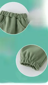 Detail of waffle knit kids joggers with elastic waistband and ribbed cuffs in mint green