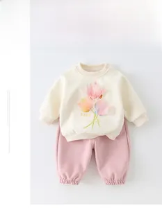 Close-up of baby sweatshirt with 3D tulip applique and easy-on snap buttons