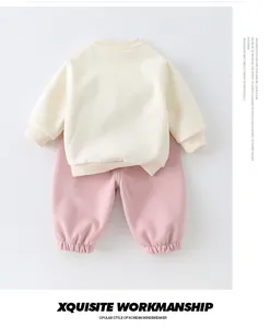 Detail of cream sweatshirt and pink joggers set for kids in soft premium cotton