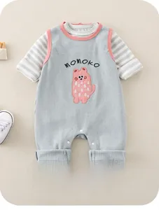 Detail of infant waffle knit romper with cartoon embroidery and striped long sleeve shirt