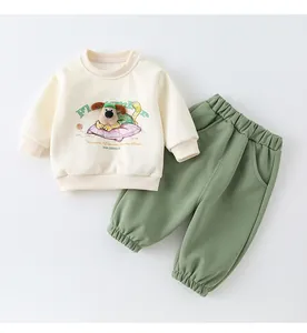 Detail of baby cotton two-piece set with 3D plush puppy embroidery and snap buttons