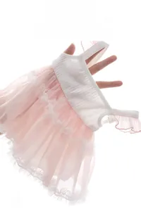Detailed view of baby girl pink tulle tutu romper with white ribbed bodice and straps
