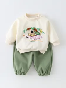 Infant cotton two-piece set featuring cream sweatshirt with dog patch and olive joggers