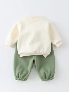 Kids cotton sweatshirt and joggers set in off-white and sage green colors