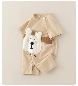 Detail of short-sleeve baby romper with lion patch embroidery and snap buttons