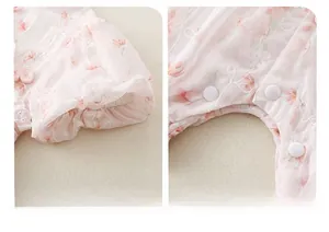 Detail of pink floral baby romper featuring puff sleeves and traditional Chinese knots